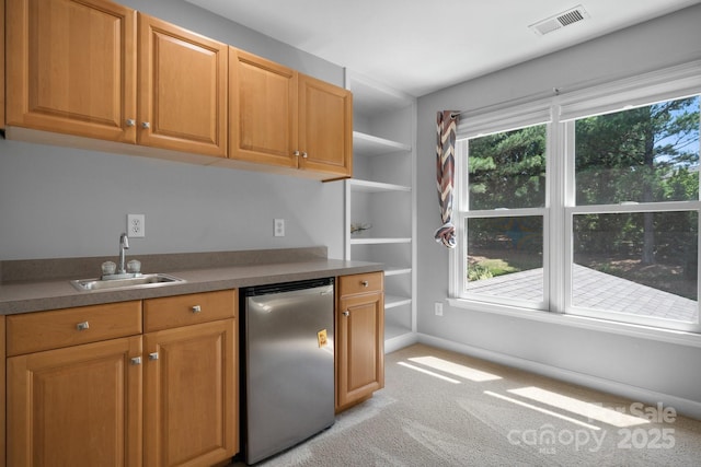 kitchen with light carpet, dishwashing machine, sink, and stainless steel refrigerator