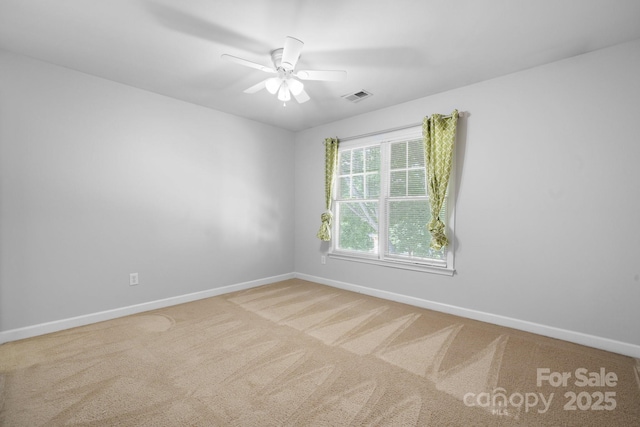 carpeted empty room with ceiling fan