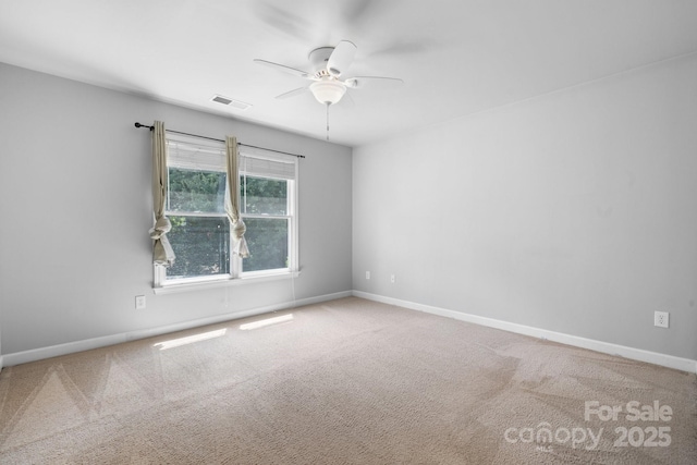 empty room with carpet floors and ceiling fan