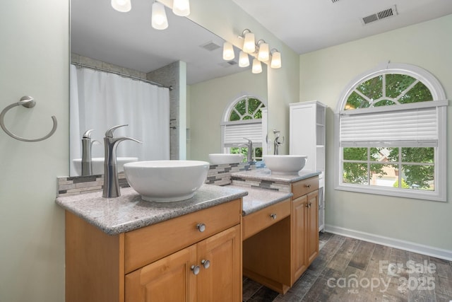 bathroom featuring hardwood / wood-style floors and vanity