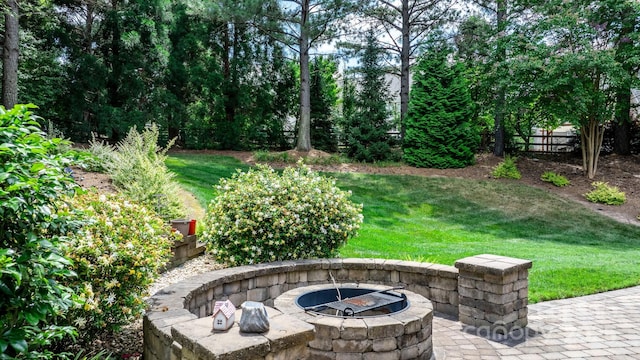 view of patio with a fire pit