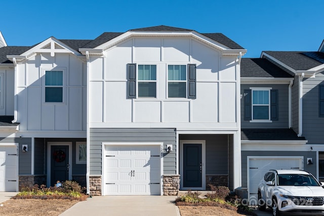 3820 Shider Ln, Kannapolis, NC 28081 - view of front of property with a garage, stone siding, concrete driveway, and board and batten siding