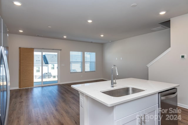 kitchen with dishwasher, a kitchen island with sink, dark wood-type flooring, white cabinets, and sink