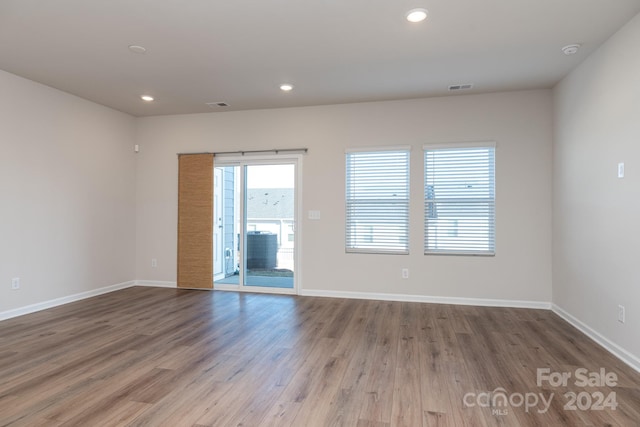 3820 Shider Ln, Kannapolis, NC 28081 - empty room with wood finished floors, a smoke detector, and recessed lighting