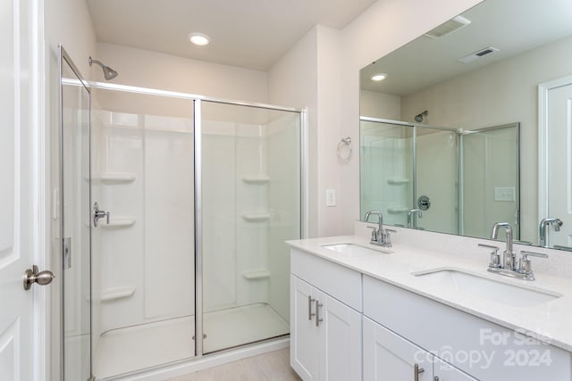 bathroom featuring vanity and walk in shower