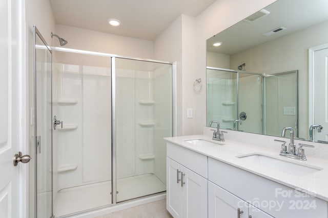 3820 Shider Ln, Kannapolis, NC 28081 - full bathroom with a stall shower, double vanity, and recessed lighting