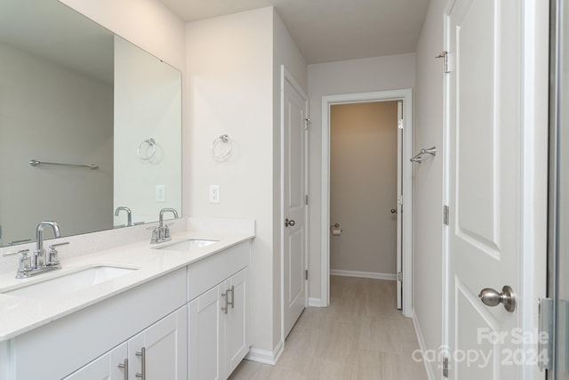 3820 Shider Ln, Kannapolis, NC 28081 - bathroom with double vanity and baseboards