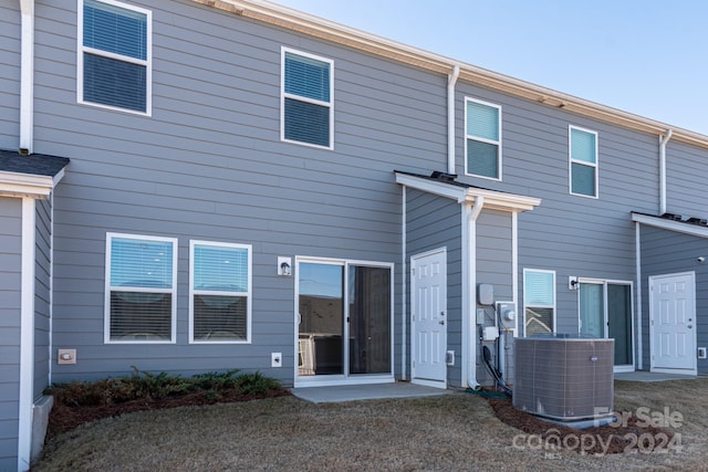 back of property with central air condition unit