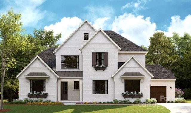 modern farmhouse featuring a garage and a front yard