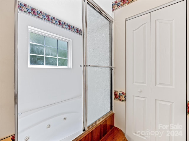 bathroom with separate shower and tub