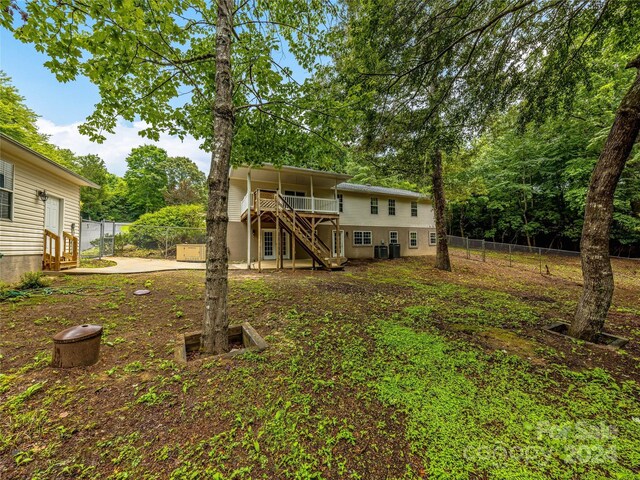 rear view of property featuring a deck