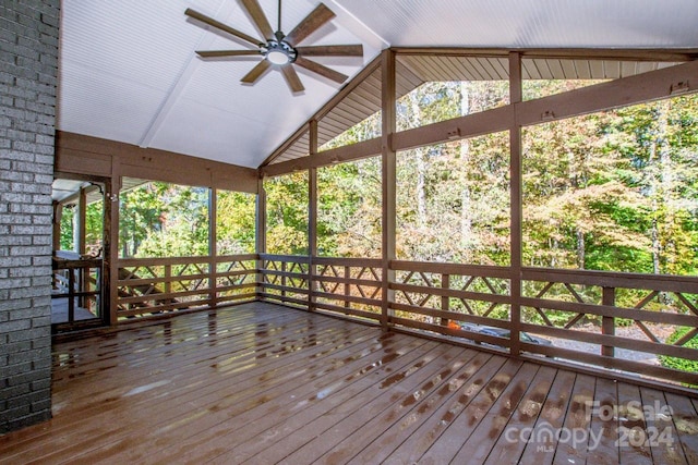 unfurnished sunroom with vaulted ceiling and ceiling fan