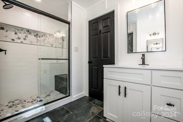 bathroom with vanity and walk in shower