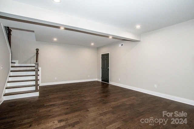 basement with dark hardwood / wood-style flooring