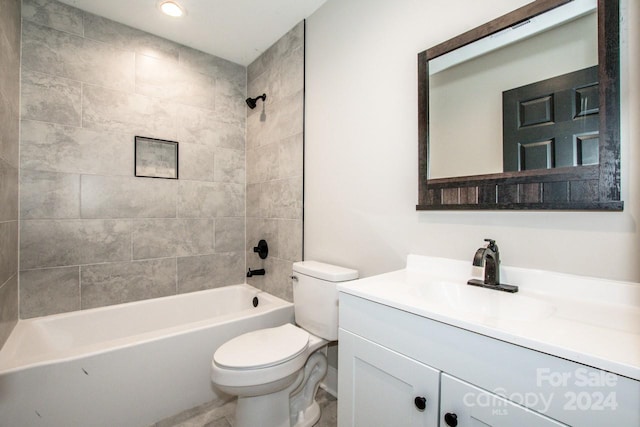 full bathroom with vanity, toilet, and tiled shower / bath combo