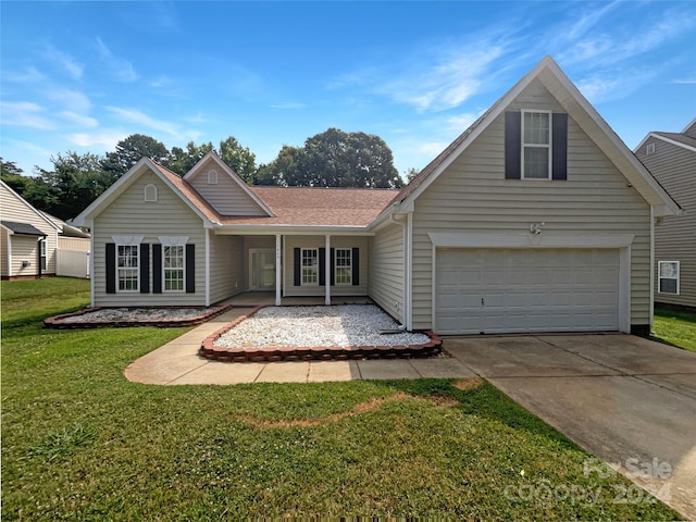 view of front of property with a garage and a front yard