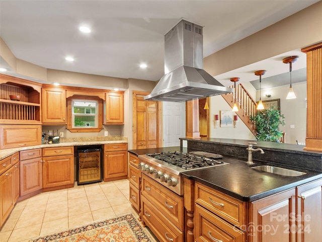 kitchen featuring sink, wine cooler, light tile patterned floors, island range hood, and stainless steel gas cooktop