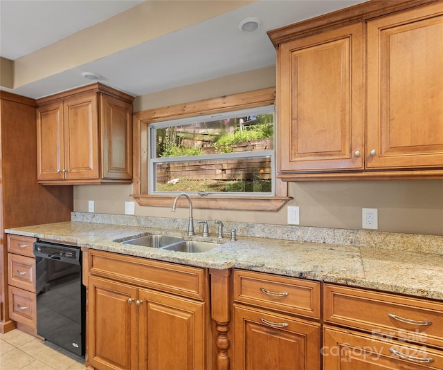 kitchen featuring dishwasher, light tile patterned flooring, light stone counters, and sink