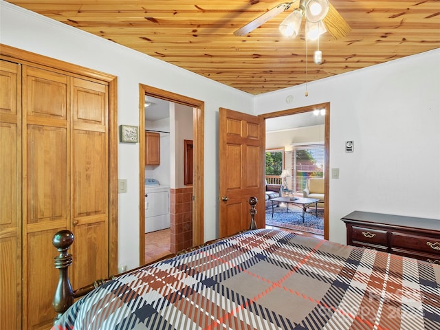 bedroom with washer / clothes dryer, ceiling fan, and wood ceiling