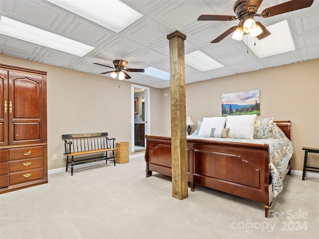 carpeted bedroom with ceiling fan and ensuite bath