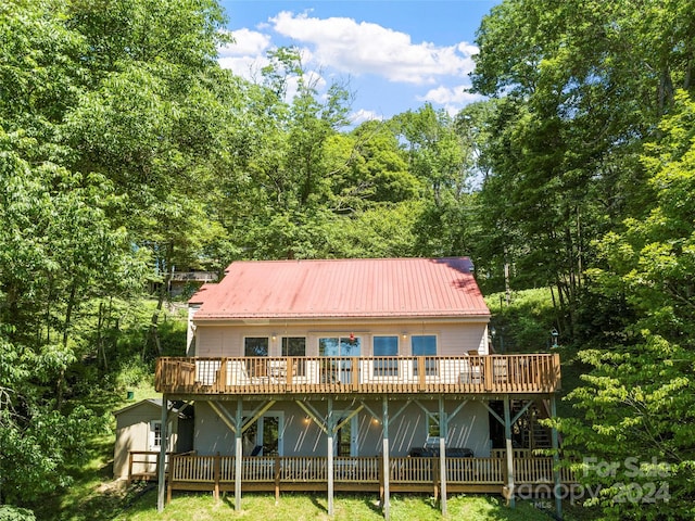 rear view of property with a deck