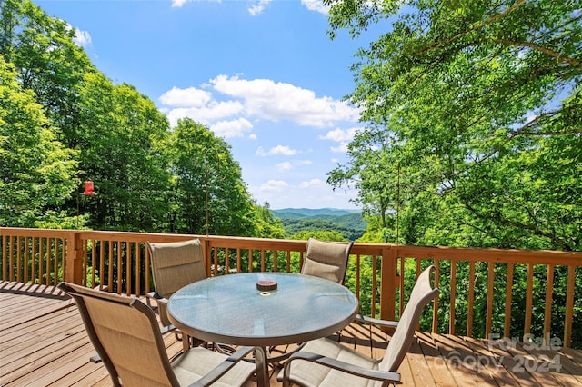 wooden deck featuring a mountain view