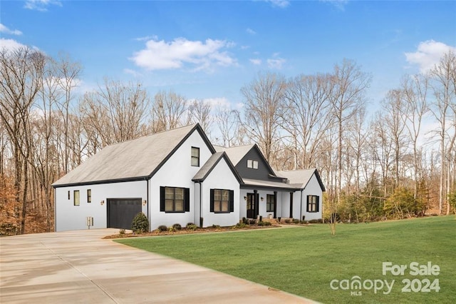 278 Triple Ponds Ct, Clover, SC 29710 - modern farmhouse style home featuring driveway, a front lawn, stucco siding, and an attached garage
