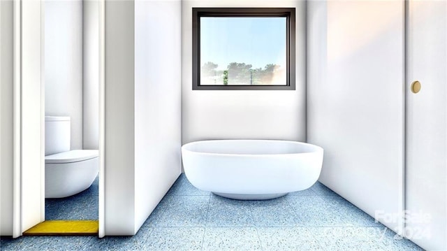 bathroom with tile flooring and toilet