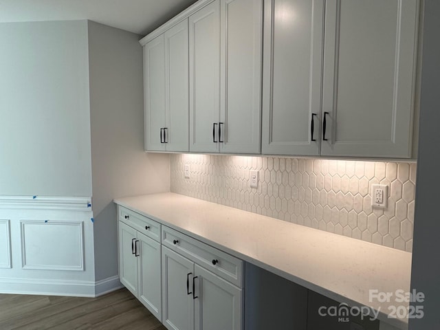 interior space featuring white cabinets and dark hardwood / wood-style floors