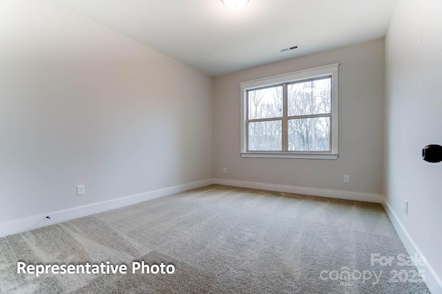 unfurnished room featuring carpet floors