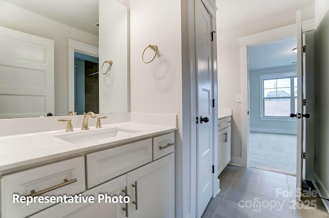 bathroom with vanity and tile patterned flooring