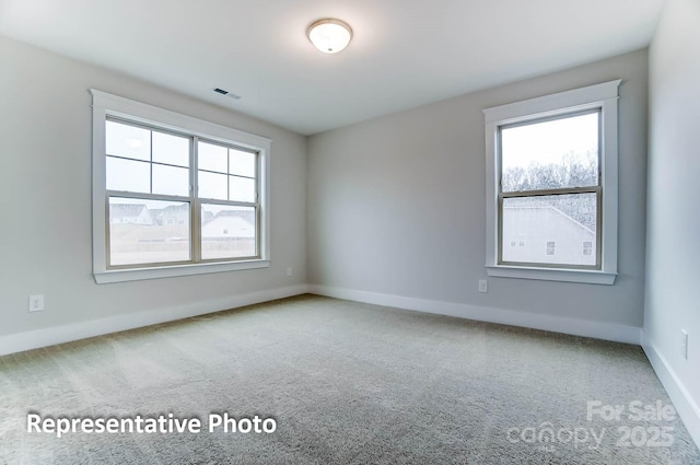 spare room with carpet floors