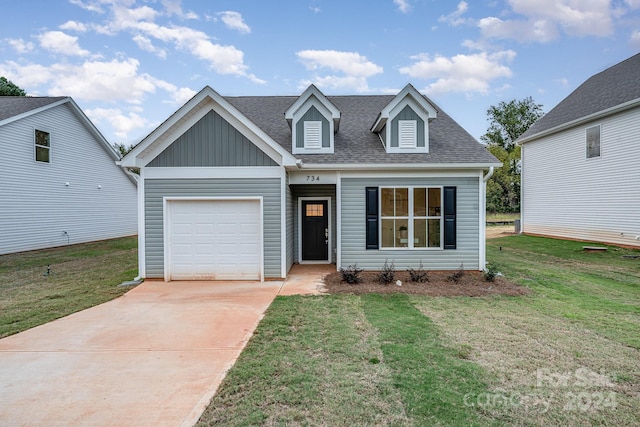 view of front facade with a front lawn and a garage