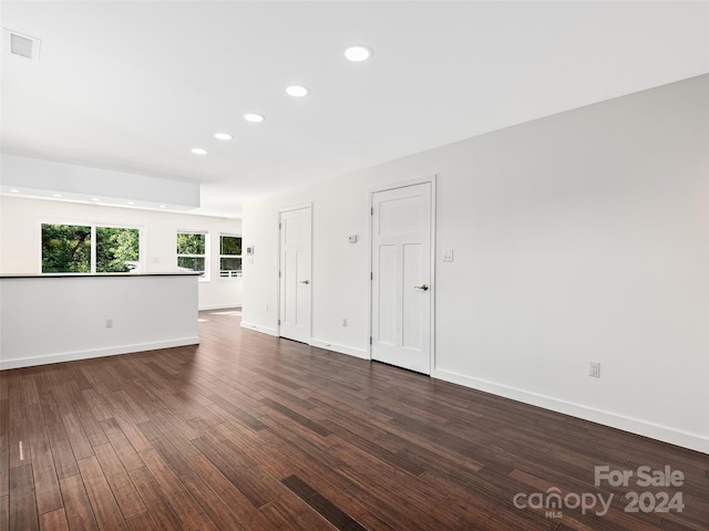 unfurnished room with dark hardwood / wood-style floors