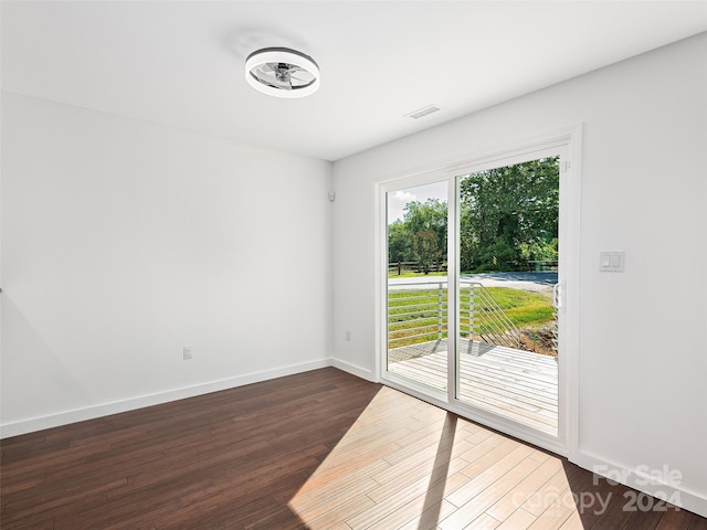 unfurnished room featuring dark hardwood / wood-style floors