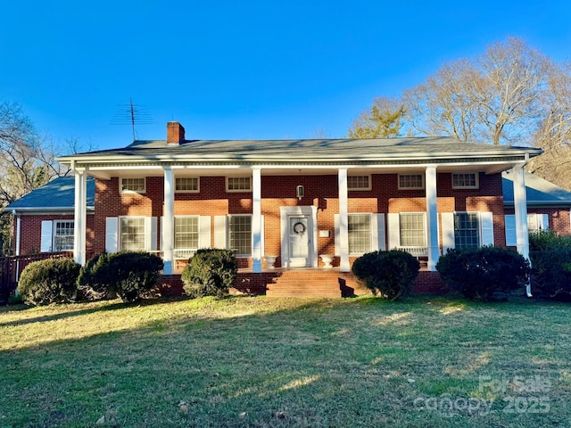 neoclassical / greek revival house with a front lawn