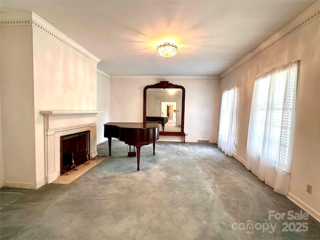 miscellaneous room with crown molding and carpet floors