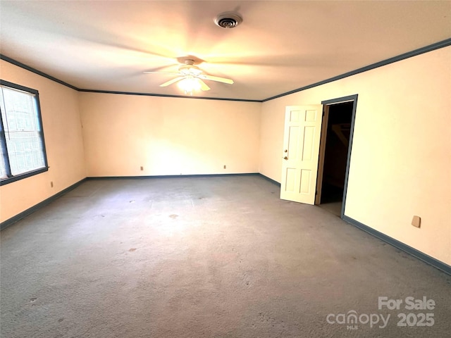 carpeted empty room featuring ceiling fan and ornamental molding