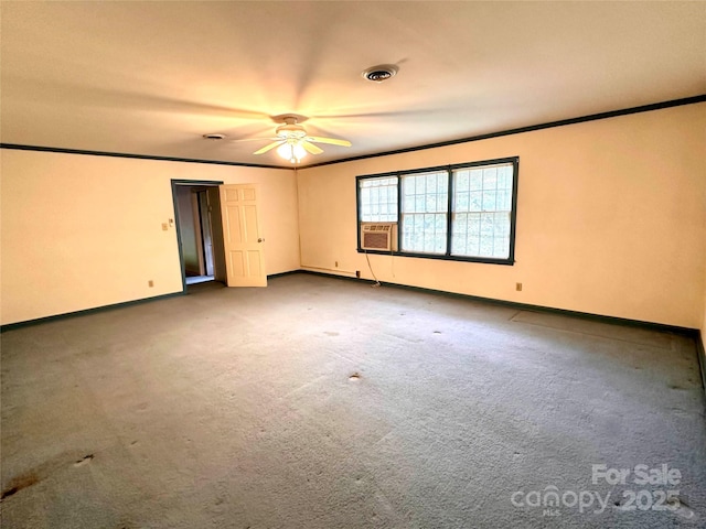 carpeted empty room with ornamental molding, cooling unit, and ceiling fan