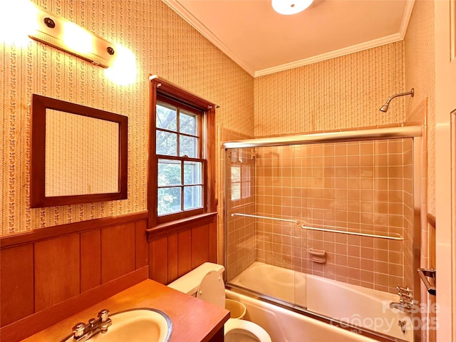 full bathroom with vanity, ornamental molding, enclosed tub / shower combo, and toilet