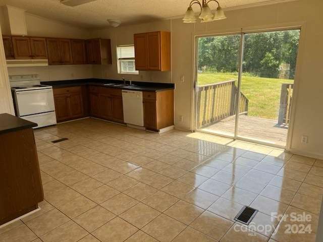 kitchen with pendant lighting, white appliances, light tile patterned floors, and exhaust hood