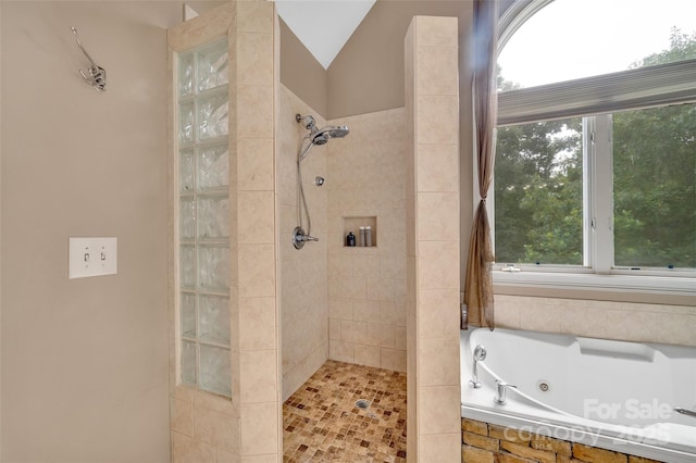 bathroom featuring plus walk in shower and vaulted ceiling