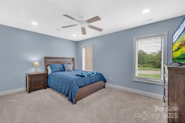 bedroom with light colored carpet and ceiling fan