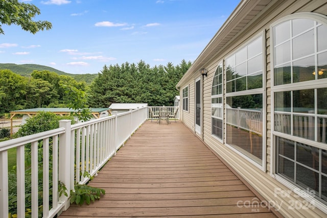 wooden deck featuring a mountain view