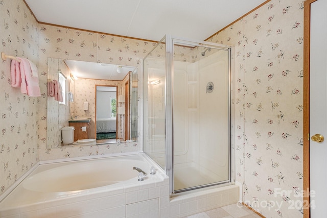 full bathroom with toilet, ornamental molding, and independent shower and bath