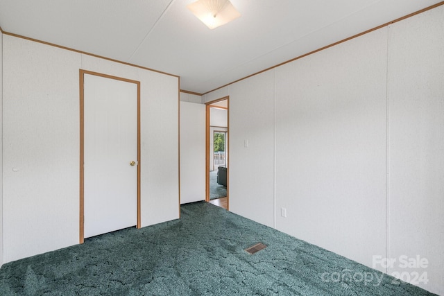 unfurnished bedroom featuring carpet