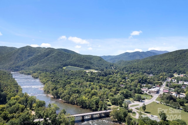 bird's eye view with a water and mountain view