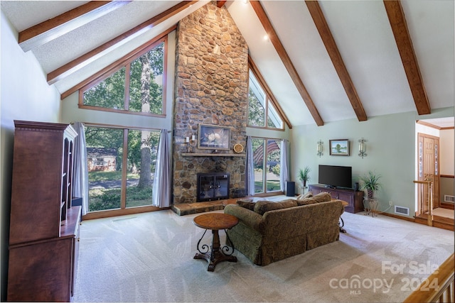 living room with high vaulted ceiling, a fireplace, plenty of natural light, and light colored carpet