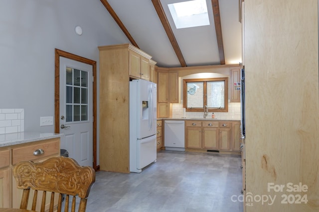 kitchen featuring sink, light stone counters, white appliances, tasteful backsplash, and light brown cabinetry