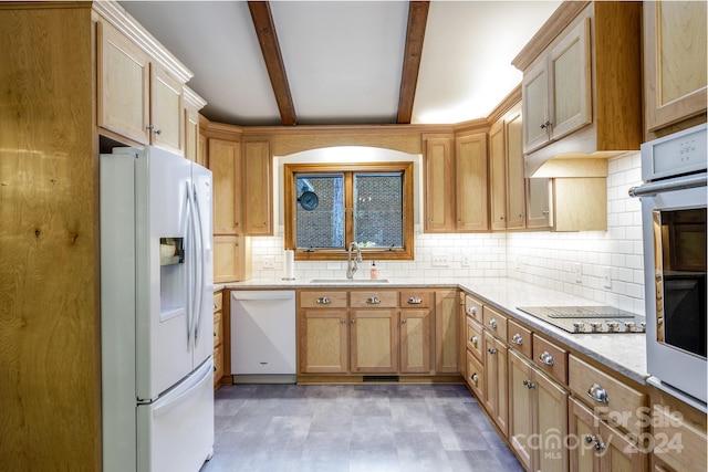 kitchen with white appliances, light brown cabinetry, beam ceiling, backsplash, and sink